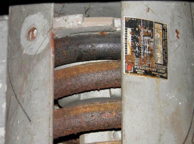 Spring coating has deteriorated and the spring is starting to corrode. While the spring is not near failure, the spring capacity is being affected and replacement should be considered.