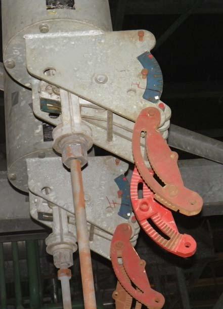 A vertical style constant support hanger that is topped out: With Anvil manufacturer, the travel indicator is the pin painted red, and it is hard against the frame (red arrow).