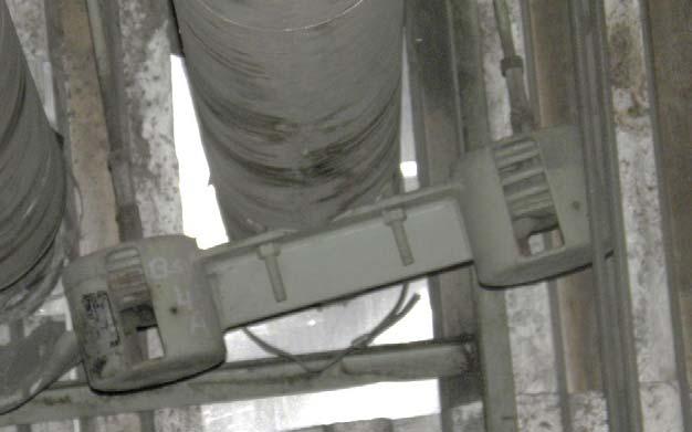 Shown is a trapeze variable spring hanger that is poorly adjusted.