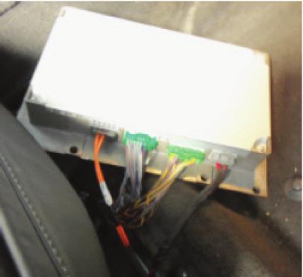 INSTALLING THE AX-VL90042 INTERFACE With the key in the off position: Locate the factory amplifier under the passenger seat. Extend the wire harness with the Gray and Green connectors to this point.