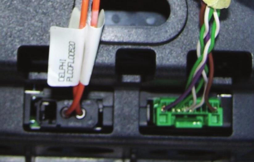 (Figure A) Note: The factory Green connector in the middle will not be used in this application. Connect the M.O.S.T. jumper harness to the factory fiber optic cable from the amplifier.