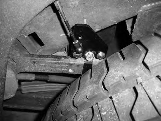 Unthread the ball stud from the autoride level sensor bracket on the rear upper control arm. The replacement upper control arm (02159B & 01464B) cannot be used on rear air-ride vehicles.