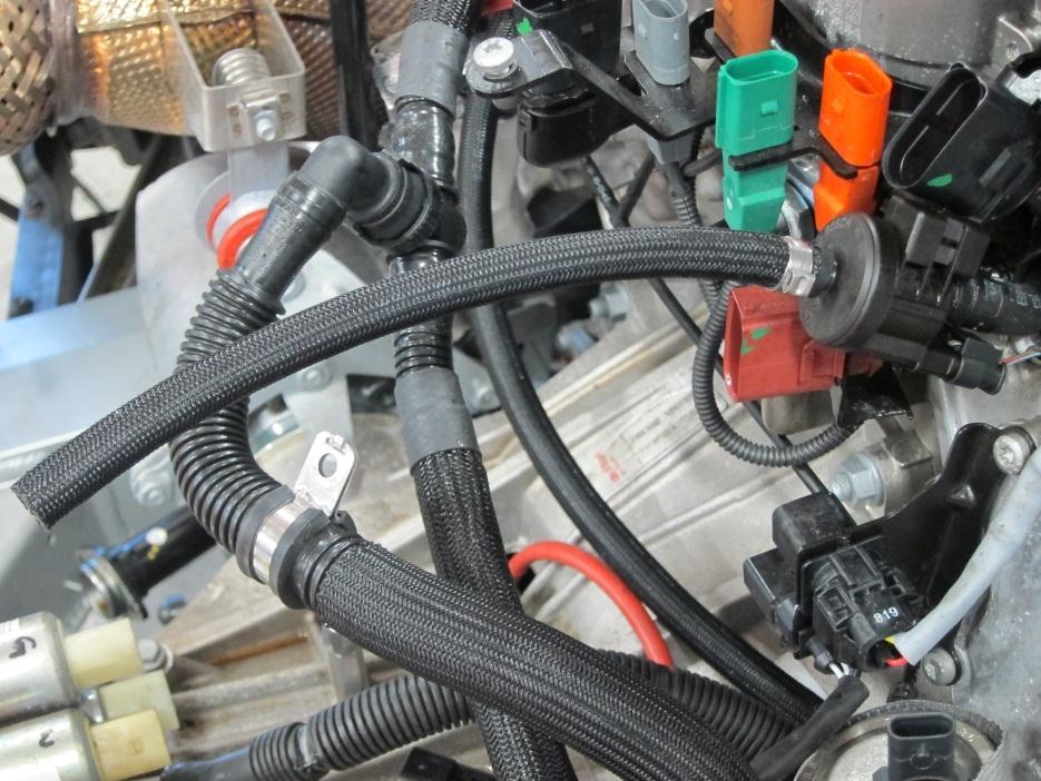 Route Coolant Breather hose on passenger side next to the fuel injectors (inside of the wire harness) to