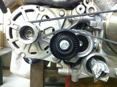 Attach 4 rib belt to the alternator pulley and main drive pulley before installing the alternator pulley.