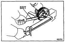 SR32 STEERING POWER STEERING VANE PUMP 15. 2JZGE: INSTALL VANE PUMP PULLEY Using SST to stop the pulley rotating, torque the nut.