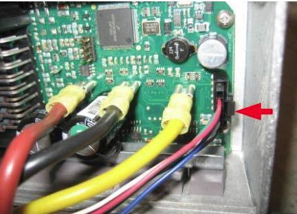 Remove the three flat pin connectors (to the left in the picture). Do NOT pull on the motor cables/wires directly. Grip the connector itself and pull. Figure 2 7.