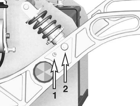 5. Unscrew and remove the two screws that hold the shock absorber in place. See figure. Fitting 1. Fit the shock absorber on the chassis with screws and washers. 2.
