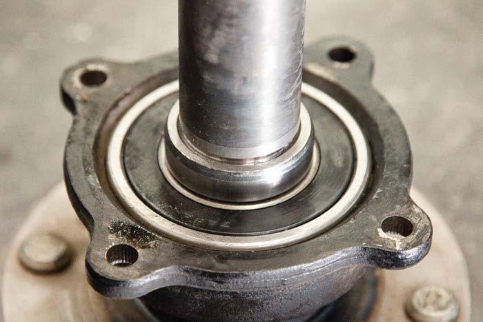 Remove the old bearing and seal from the bearing pocket if you plan on installing new ones.