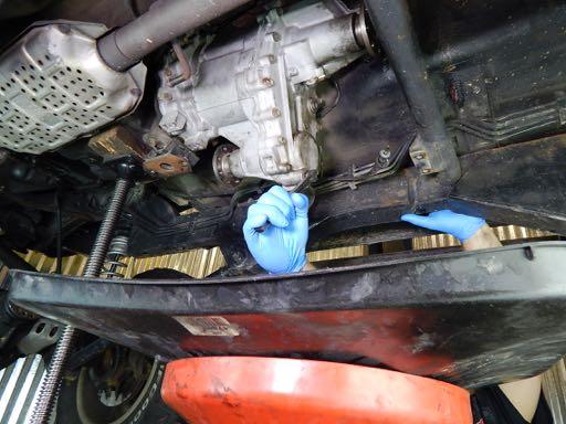Step 35 Begin separating the transfer case from the
