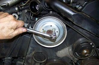 Remove the power steering pump pulley. Step 6. Remove the three water pump bolts, marked 1, 2, and 3 in our photo.