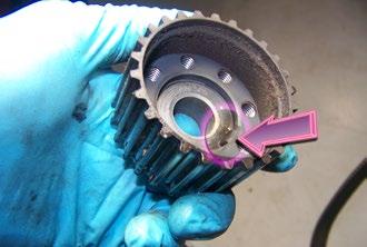Step 16. Pull the crankshaft sprocket off the crank snout by hand, and flip it over.