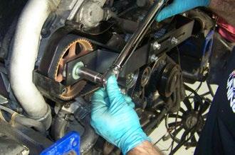 Remove the crankshaft locking tool and reinstall the timing hole plug removed