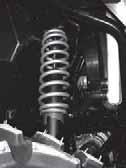 MAINTENANCE Suspension Adjustments The front and rear suspensions can be adjusted to provide a stiffer suspension, if necessary. 1.