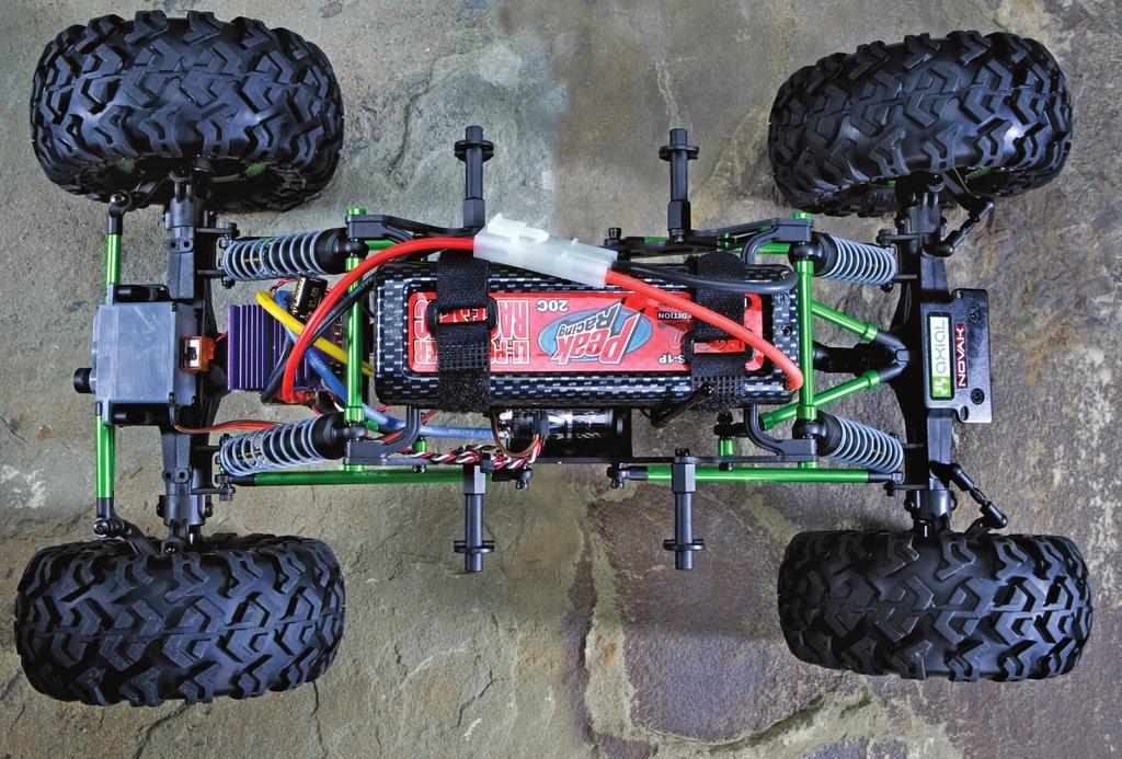 Axial saves a few bucks with plastic shock bodies.
