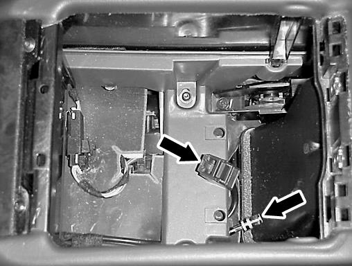Remove the lower storage box by removing the two plastic rivet pushpins at the bottom (B, Figure 23).