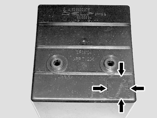 Turn the storage box bottom-side-up and cut out, or carefully knock out, the 19-mm perforated square (Figure 27).