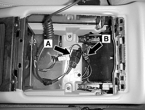 Place the storage box and upper compartment near their installation point and connect the RJ-45 (A, Figure 31) and mini- UHF (B, Figure