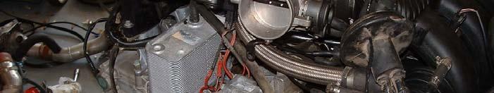 the oil filler tube and the coolant hose from the
