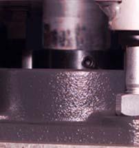 3) Loosen both setscrews in each of the shaft bearings.