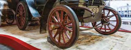 They are wooden spoked wheels. Find an old car in the Museum and draw the wheel. Find a modern car in the Museum and draw the wheel.
