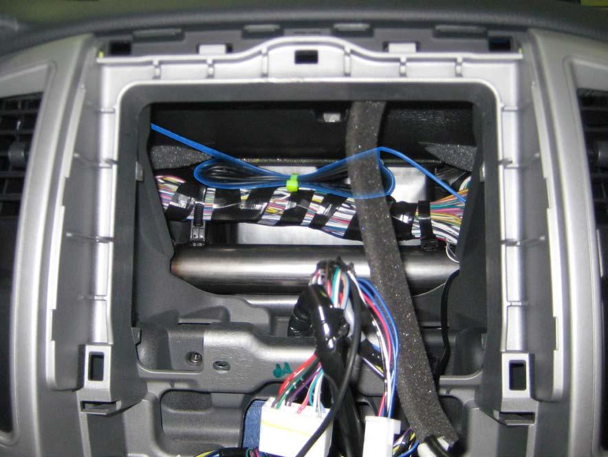 8. Bundle up the excess BLU Logic harnesses and secure it to the wire loom above the dash support beam (Fig. 1-25). NOTE: Ensure that the BLU Logic harness is positioned above the dash support beam.