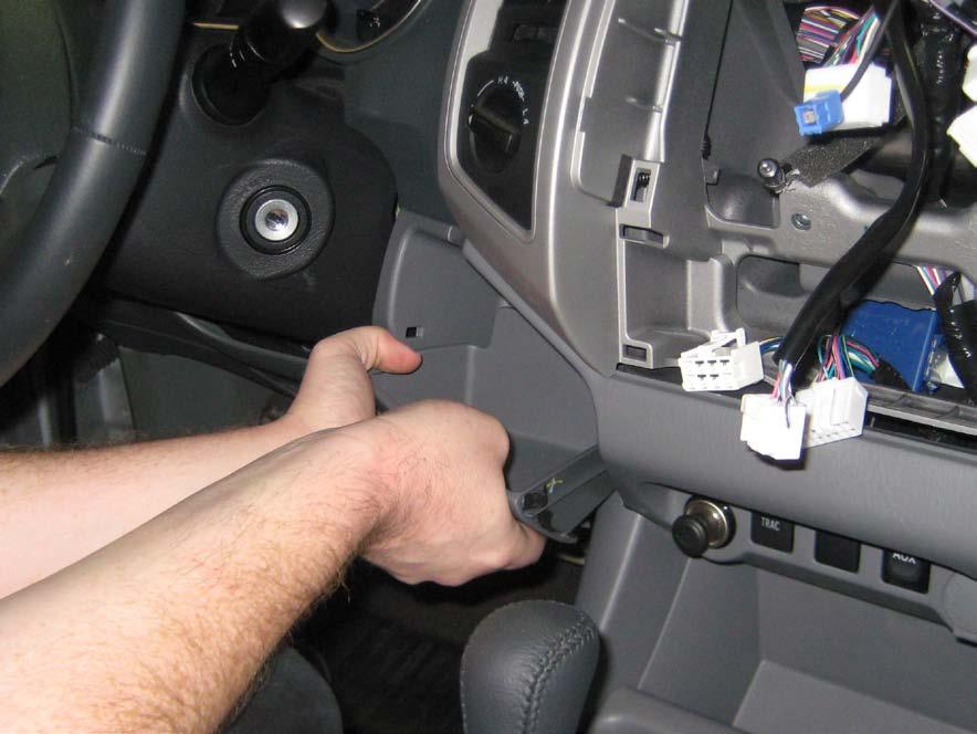 2. Using your hands, gently pull out the radio (Fig. 1-4). 3.