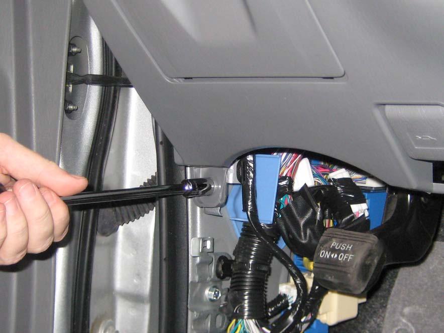 Leaving a pig tail that will connect to the BLU Logic switch, remove most of the slack and secure to existing wire loom with wire ties (Fig. 1-12).