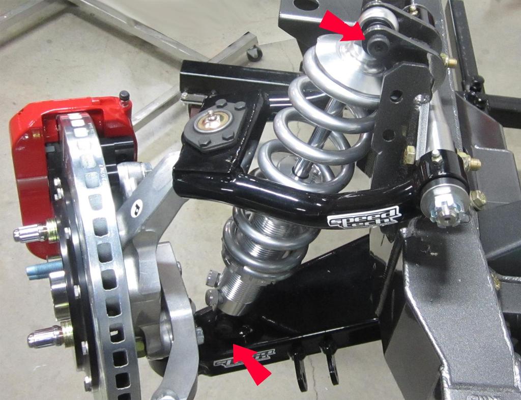 7. Install the shock into the lower control arm and the upper shock mount. Install the socket head shoulder bolts and accompanying nylock nuts and tighten them to 20 ft/lbs.