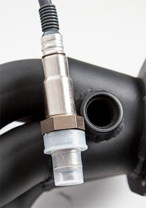 Locate a position for the oxygen sensor as close to the engine as possible. The oxygen sensor should be mounted at a point where it can read a good average of all the cylinders on one bank.