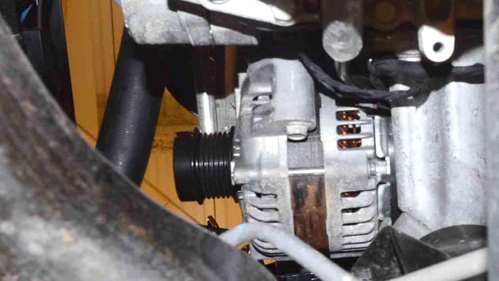 Safety Recall T75 -- Alternator Page 5 Service Procedure (Continued) ALTERNATOR LOWER RETAINING BOLT ALTERNATOR ASSEMBLY Figure 5 Lower Alternator Retaining Bolt (viewed from under vehicle) 9.