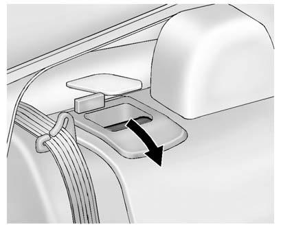 Always unbuckle the safety belts and return them to their normal stowed position before folding a rear seat. To fold the seatback down: 1. Lower the rear seat head restraints completely.