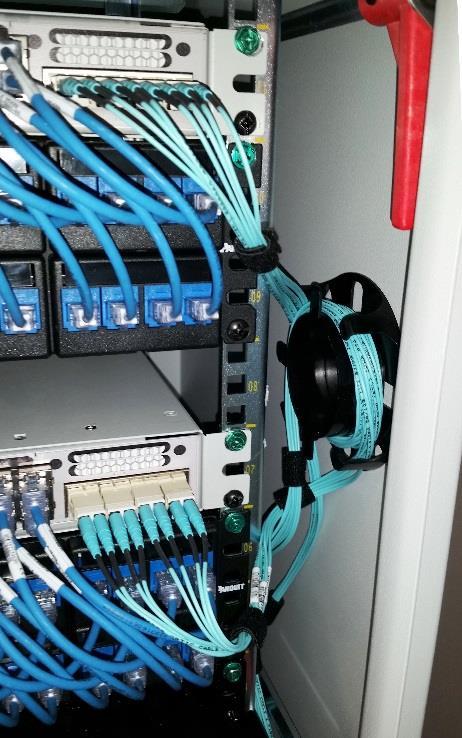 Connect the switch to the patch panel in RUs 5 and 6.
