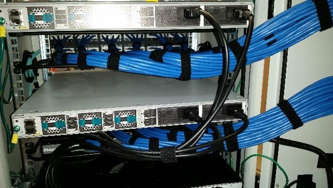 29. Connect fiber patch cables to the management ports on the right side of the enclosure as shown by the aqua cables in Figure 25. Panduit recommends using part number FX2ERLNLNSNM001, 2-fiber OM3 1.