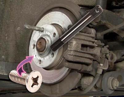 (Note: If you want to remove the brake caliper and rotor as an assembly, leave the hand brake applied, locking the caliper and rotor together.
