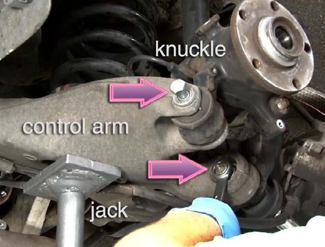 Step 9 Place a jack under the control arm and raise it slightly.