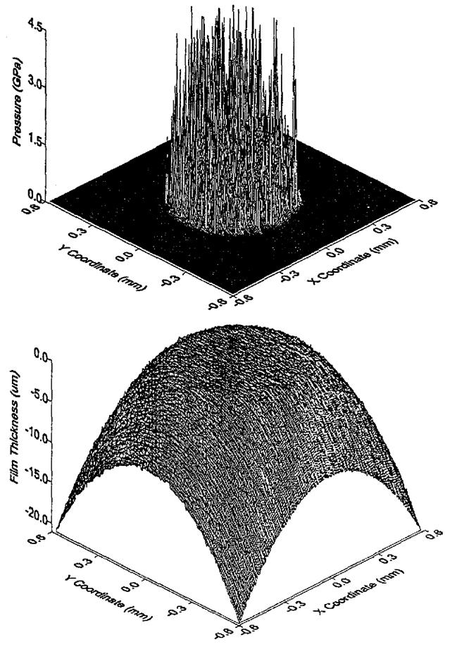 FIGURE 29.41 Total pressure distribution (top) and film shape (bottom) for a three-dimensional rough surface on 421 421 grids with pure rolling mode, nondimensional load W* = 8.