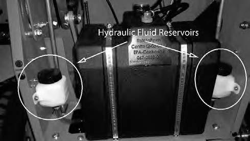 SERVICE SECTION SECTION 1: HYDROSTATIC SYSTEM The hydraulic fluid reservoirs are accessed by raising the seat forward. Notice the full cold line at the bottom of the tank.