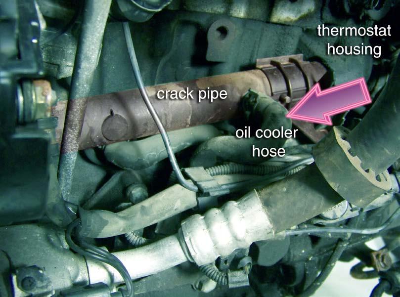 Replace the Water Pipe Step 5 This straight coolant tube commonly called the water pipe runs across the engine.