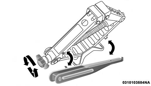 Remove the scissors jack and lug wrench from the spare wheel as an assembly. Turn the jack screw to the left to loosen the lug wrench and remove the wrench from the jack assembly.