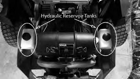 SERVICE SECTION SECTION : HYDROSTATIC SYSTEM The hydro reservoir tank on the Outlaw model is located on each side of rear cover. Notice the full cold line at the bottom of the tank.