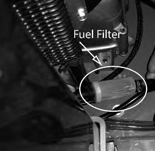 The fuel filter is located in the fuel line about from the carburetor on the side of the engine. Replace the filter yearly.