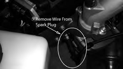 . Changing the spark plugs and checking the spark plug gap: ) Remove the wire on the spark plug and use a / socket to remove the spark
