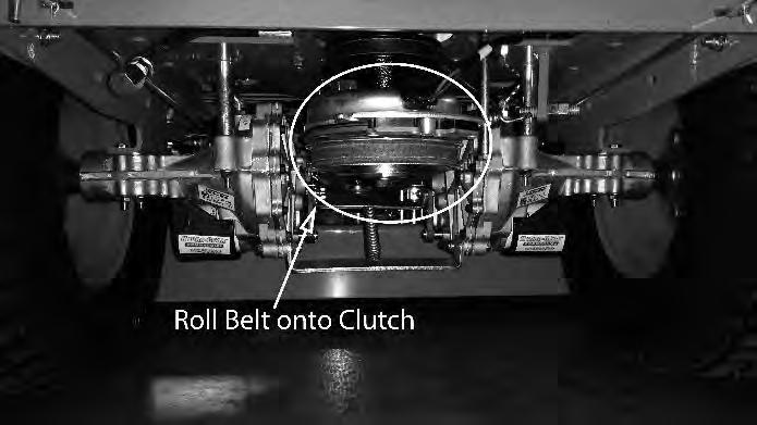 ) While lifting up on the belt (as shown in the photograph), rotate the pulley until the belt is