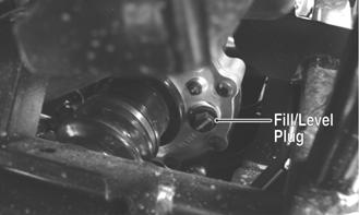Using the oil filter wrench and a ratchet handle (or a socket or box-end wrench), remove the old oil filter and dispose of properly. Do not re-use oil filter.