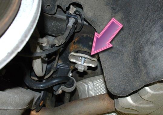 plastic panel, and the large bolt at the front of the subframe