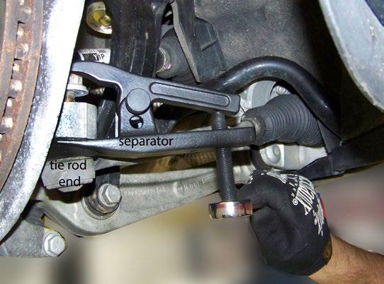 Remove the Lower Front Strut Step 5 Use a tie rod separator to press the tie rod end from its tapered seat in the