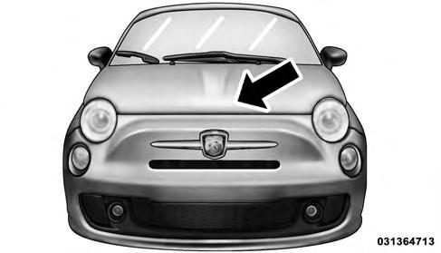 Rotate the safety catch under the front edge of the hood, near the center, and raise the hood. Hood Safety Latch Location 3.