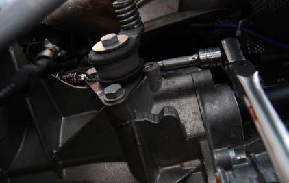 REMOVING THE TRANSMISSION Step 31: Using a 16mm 12 point box end wrench, remove the four lower