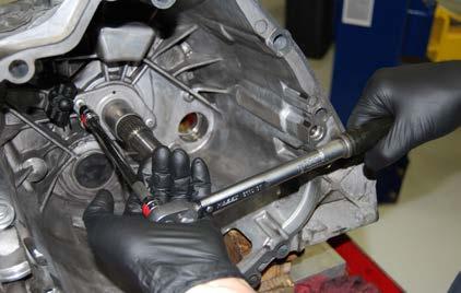 SERVICING THE CLUTCH RELEASE MECHANISM Step 5: Clean the area under the guide sleeve and carefully