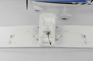 Loosen the screws on the servo control horns, then center to control surfaces of the airplane.